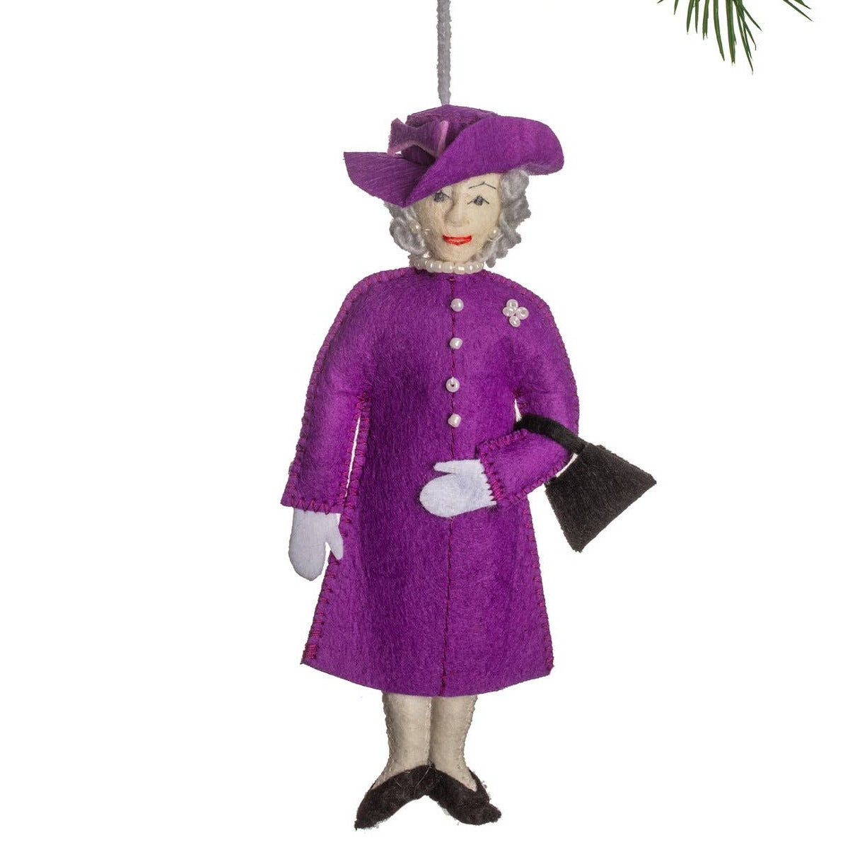 Decorative ornament of queen elizabeth in a purple coat and hat on a white background